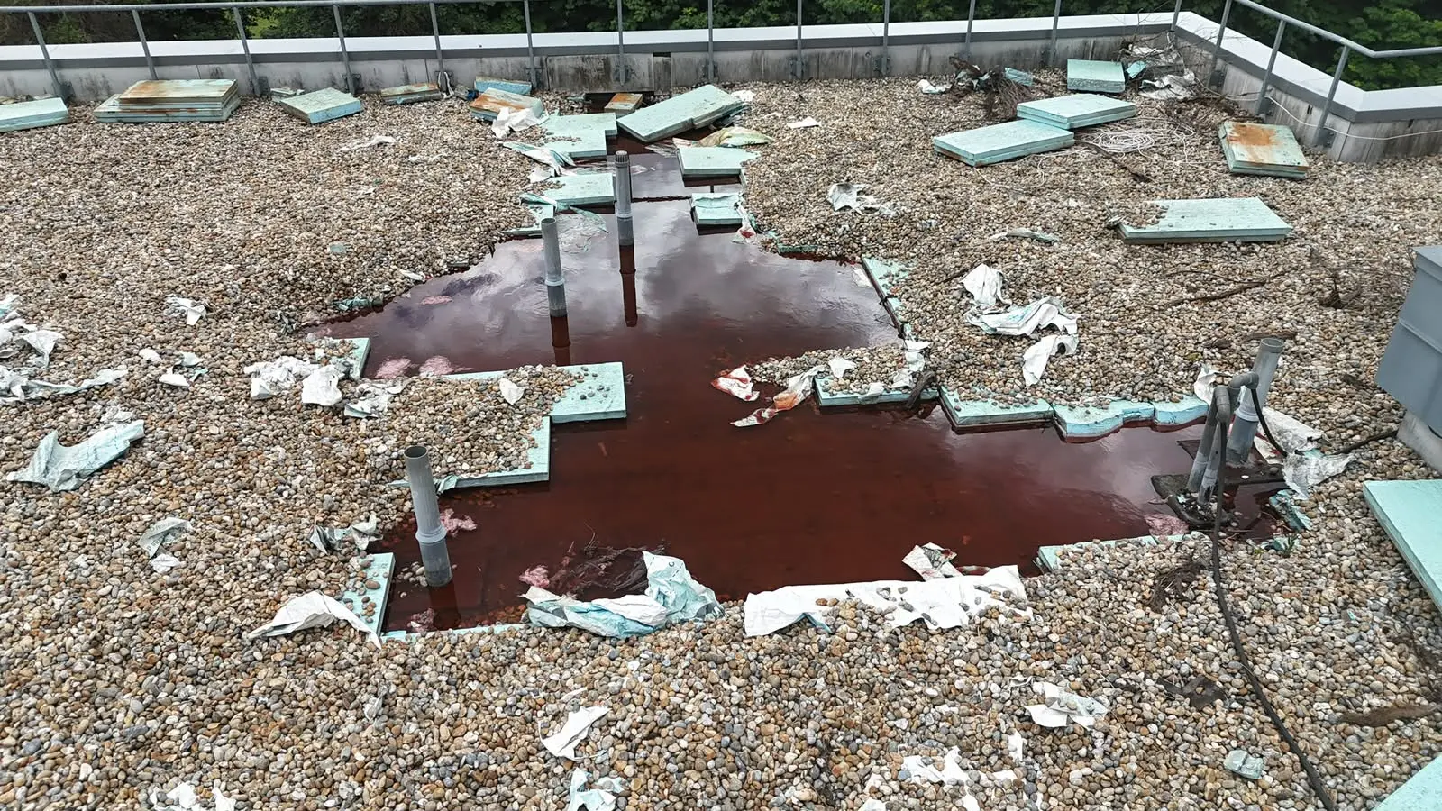 Drone inspection showing standing water and damaged insulation on a flat roof