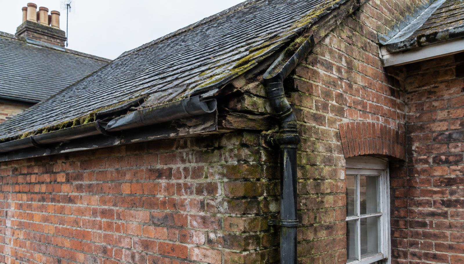 Deteriorated masonry and rainwater goods requiring urgent property attention